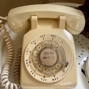 Vintage 1960s almond rotary corded landline telephone