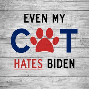 May include: A woodgrain background with the text "Even my cat hates Biden" in black and red letters. The word "cat" is made up of a blue "C" and a blue "T" with a red paw print in between.