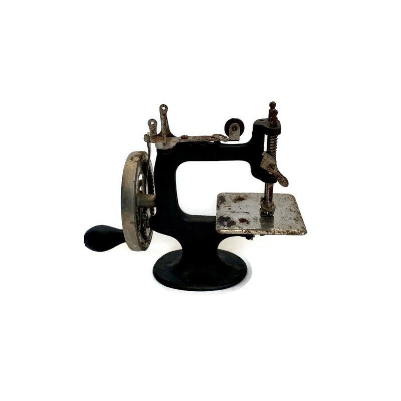 Lot - CHILD'S ANTIQUE PETER PAN SEWING MACHINE