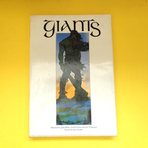 May include: A book titled "Giants" with a white cover and a colorful illustration of a giant figure holding a weapon. The title is in a stylized font. The illustration features a green giant against a blue and green background.