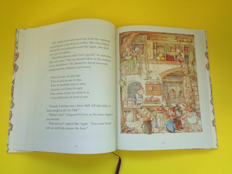 May include: An open book with colorful illustrations. The right page shows a detailed drawing of a kitchen scene with mice preparing food. The left page has printed text. The book is on a yellow surface.