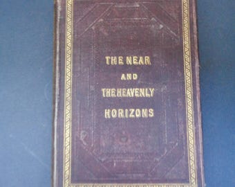 May include: A vintage book with a maroon leather cover and gold lettering. The title of the book is "The Near and the Heavenly Horizons".