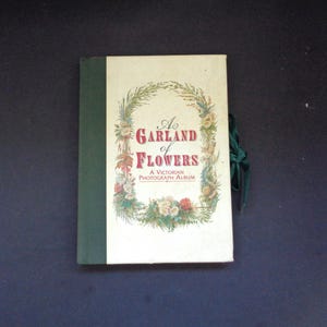 A Garland of Flowers - A Victorian Photograph Album with ribbon fastening.