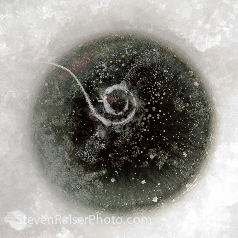 Color photograph of an Ice Fishing Hole 3 image 1