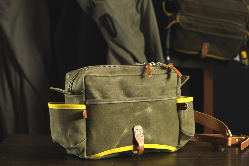 Brown Minimalist Waxed Canvas and Leather Fly Fishing Bag with Front Mounted Net Slot and Creel Style Strap