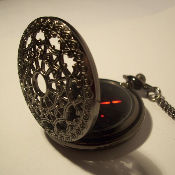 Black hollow web design pocket watch with a red LED display. Gothic style watch with a science fiction, steampunk twist.