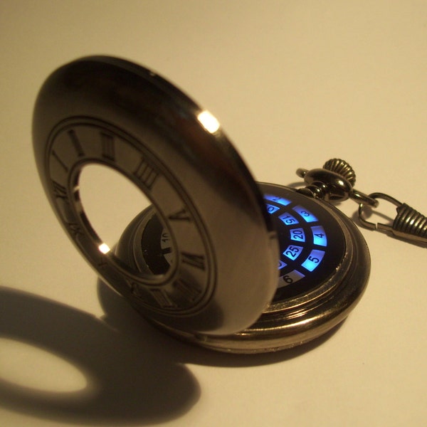 Gun metal roman numeral LED pocket watch with blue display. Classic fob watch with science fiction, steampunk twist.