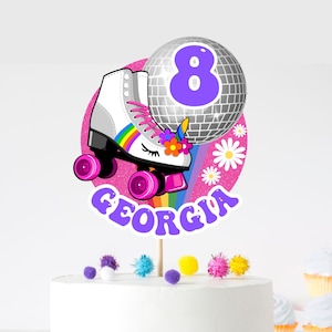 May include: A pink and white cake topper with a white roller skate with rainbow accents, a disco ball, and the name "GEORGIA" in purple letters. The number 8 is on the disco ball.