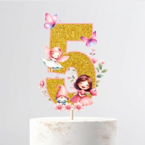 May include: Gold glitter number five cake topper with pink outline. The number is decorated with pink flowers, butterflies, and fairies. There is a gnome in the bottom left corner.