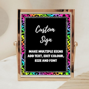 May include: A gold-framed sign with a black background and a rainbow leopard print border. The sign says "Custom Sign" and "Make multiple signs, add text, edit colour, size and font".