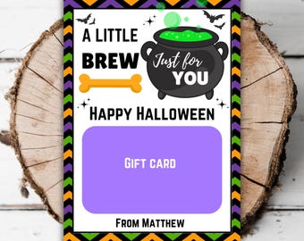 May include: Halloween gift card with a purple section for a gift card. The card features a black cauldron with green bubbling liquid, a bone, and the text "A Little Brew Just for You Happy Halloween." The card is framed with orange, black, green, and purple zigzags.
