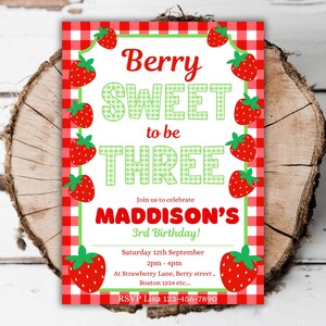 May include: A birthday invitation with a red and white checkered border and strawberry illustrations. The text reads "Berry Sweet to be Three" and invites guests to Maddison's 3rd birthday party on September 12th.