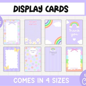 May include: A set of eight rectangular display cards featuring pastel purple backgrounds with various graphic elements including rainbows, daisies, butterflies, bows, and gingham patterns. The text includes "DISPLAY CARDS", "10 DESIGNS INCLUDED", "COMES IN 4 SIZES", "EDIT IN Canva", "Add your shop name", "Thank you", "Add your logo", and "Product title".