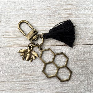 Antiek bronzen bijentasje bedel, honingraat, hommel, zwarte kwast, clip voor tas, messingkleurige ritssluiting, sleutelhanger, sleutelhanger honingbij