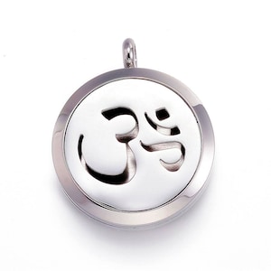 May include: Silver stainless steel aromatherapy diffuser necklace with an Om symbol cutout.