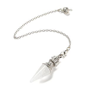 May include: A silver-colored pendulum with a clear, pointed crystal at the bottom. The crystal is encased in a decorative silver metal cap. A silver chain connects the crystal to a small, decorative silver bead.