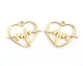 May include: Two gold-colored metal heart-shaped charms with a heartbeat design inside. The charms have a loop at the top for attaching to jewelry.