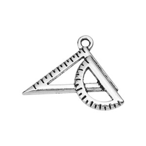 May include: Silver-toned metal charm shaped like a protractor and triangle, a common tool used in geometry.