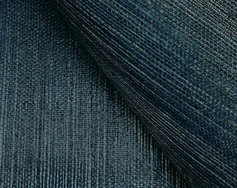 Op de afbeelding: Close-up van een donkerblauwe, textuurrijke stof met een subtiel geweven patroon.