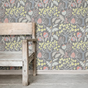 May include: A wooden bench with a grey and green floral wallpaper background. The wallpaper features a repeating pattern of trees, leaves, and flowers.