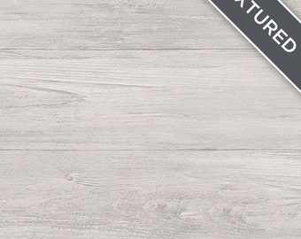 Puede incluir: Fondo de madera blanqueada con una superficie texturizada. La madera tiene un color gris claro y un patrón de veta natural.