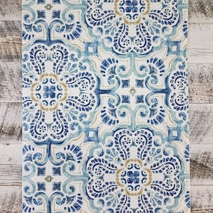May include: Blue and white patterned wallpaper with a repeating tile design. The tiles feature intricate floral patterns in shades of blue, white, and gold.