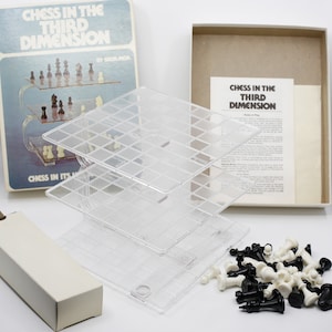 May include: A vintage "Chess in the Third Dimension" board game. The box, with the game title, is open, revealing clear plastic game boards and chess pieces. The game includes a box with instructions and a small cardboard box.