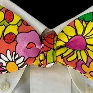 POP ART GARDEN: A melange hot colors - pinks, yellow, red, green swirl together with flowers and fruits. For groovy dressers