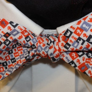 CHECKMATE-- Handmade Liberty of London Bowtie With Chess Themed Figures in red, gray, white and black, for the Well-Dressed