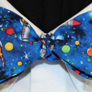 FLY Me To The MOON: Novelty cotton, rocket ships, planets, handmade bow tie, bright blue background, out-of-this-world