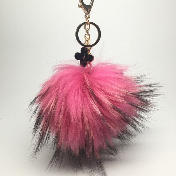 Pink with natural markings Raccoon Fur Pom Pom luxury bag pendant + black flower clover charm keychain