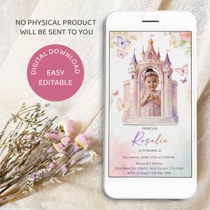 May include: A smartphone displays a digital invitation with a princess theme. The invitation features a watercolor castle, butterflies, and a photo of a child. Text includes "Rosalie is turning 2!" and event details. The phone is on a white surface.