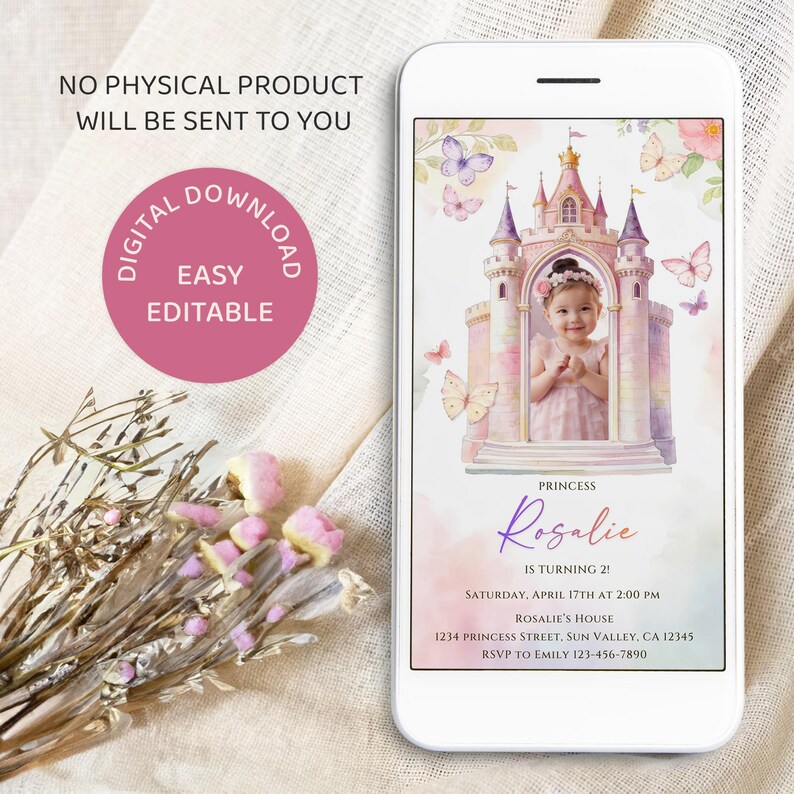 May include: A smartphone displays a digital invitation with a princess theme. The invitation features a watercolor castle, butterflies, and a photo of a child. Text includes "Rosalie is turning 2!" and event details. The phone is on a white surface.
