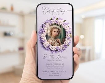 May include: A purple and white floral wreath with a photo of a woman inside. The text "Celebrating the life of" is at the top of the image. The text "Dorathy Brown" is below the wreath. The text "22.05.1945 - 14.07.2023" is below the name. The text "Service to be held at" is below the date. The text "Sunday, April 22, 2006 at 12:00 PM" is below the service heading. The text "Local Church, Address, NY" is below the date and time. The text "Followed by a reception at" is below the church information. The text "The Local Park" is below the reception heading. The text "Address, Newyork, NY" is below the park name.