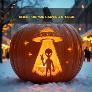 May include: A carved orange pumpkin featuring an alien pumpkin carving stencil design. The cutout depicts a UFO beaming down an alien figure making a peace sign, surrounded by four-pointed stars. The interior is illuminated with a warm glow.
