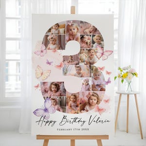 Puede incluir: Un gran letrero de cumpleaños blanco con un collage de fotos de bebé con la forma del número 3. El letrero está decorado con mariposas de acuarela y el texto "Happy Birthday Valeria" y la fecha.