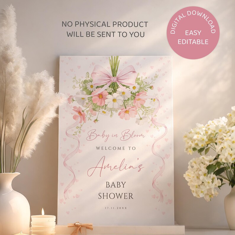 May include: A baby shower welcome sign with a floral bouquet and pink ribbon design. The sign reads "Baby in Bloom" and welcomes guests to Amelia's baby shower. The sign is a digital download.