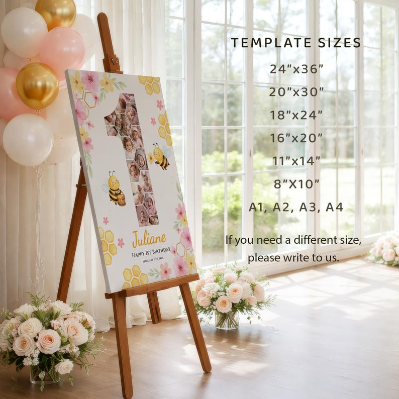 May include: A wooden easel displays a personalized canvas print for a first birthday. The print features a large number one filled with photos, floral accents, and bee illustrations. Text includes the name "Juliane" and "Happy 1st Birthday". Template sizes are listed.