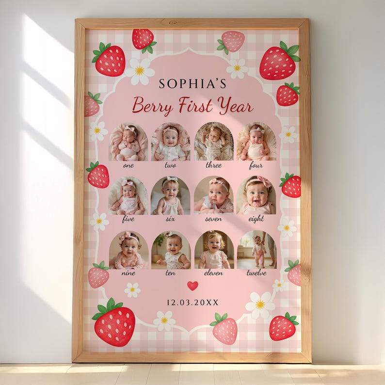 May include: A framed, pink and white gingham print featuring a baby's monthly photos. The print includes the text "SOPHIA'S Berry First Year" and is decorated with strawberry and flower illustrations. The date "12.03.20XX" is also included.