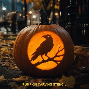 May include: A carved orange pumpkin featuring a circular cutout with a silhouette of a raven perched on a branch. The interior is illuminated with a warm glow, highlighting the bird's form. The text PUMPKIN CARVING STENCIL appears at the bottom.