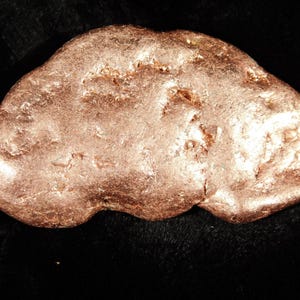 May include: A set of three ceramic mugs with a speckled, matte finish. The mugs are in shades of cream, light gray, and dark gray. Each mug has a simple, modern design and a rounded handle.