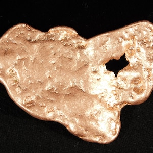 May include: A set of three ceramic mugs with a speckled, matte finish. The mugs are in shades of cream, light gray, and dark gray. Each mug has a simple, minimalist design and a rounded handle.