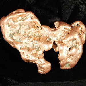 May include: A set of three ceramic mugs with a speckled, matte finish. The mugs are in shades of cream, light gray, and dark gray. Each mug has a simple, minimalist design and a rounded handle.