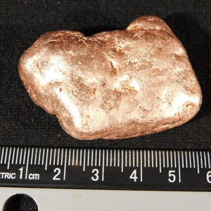 May include: A set of three ceramic mugs with a speckled, matte finish. The mugs are in shades of cream, light gray, and dark gray. Each mug has a simple, minimalist design and a rounded handle.