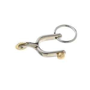 May include: A silver metal keychain shaped like a cowboy spur with a gold-coloured wheel on the end. The keychain has a silver metal ring attached to it.