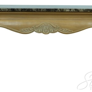 May include: A light brown console table with a marble top. The table features ornate carvings on the apron and legs. The legs are curved and end in a scroll design. The table is approximately 48 inches long.