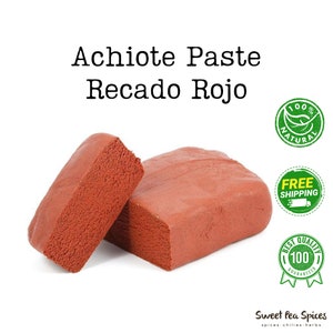 May include: Two blocks of red achiote paste, a traditional Mexican spice, labeled "Achiote Paste Recado Rojo". The product is labeled as 100% natural and comes with free shipping.