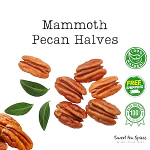 May include: A close-up of pecan halves, with a white background. The pecans are arranged in a semi-circle, with some leaves scattered around them. The text "Mammoth Pecan Halves" is at the top of the image.