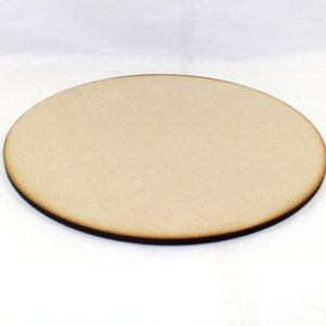 May include: A round, unfinished wooden disc with a dark brown edge. The disc is approximately 10 inches in diameter.