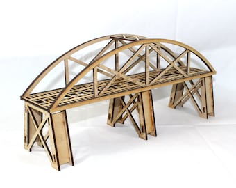 May include: A wooden model of a bridge with a brown stain. The bridge has a curved arch and is supported by four pillars.
